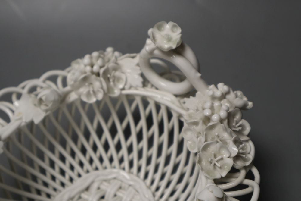 A Derby Sampson Hancock intricate basket white glazed together with an early Belleek basket